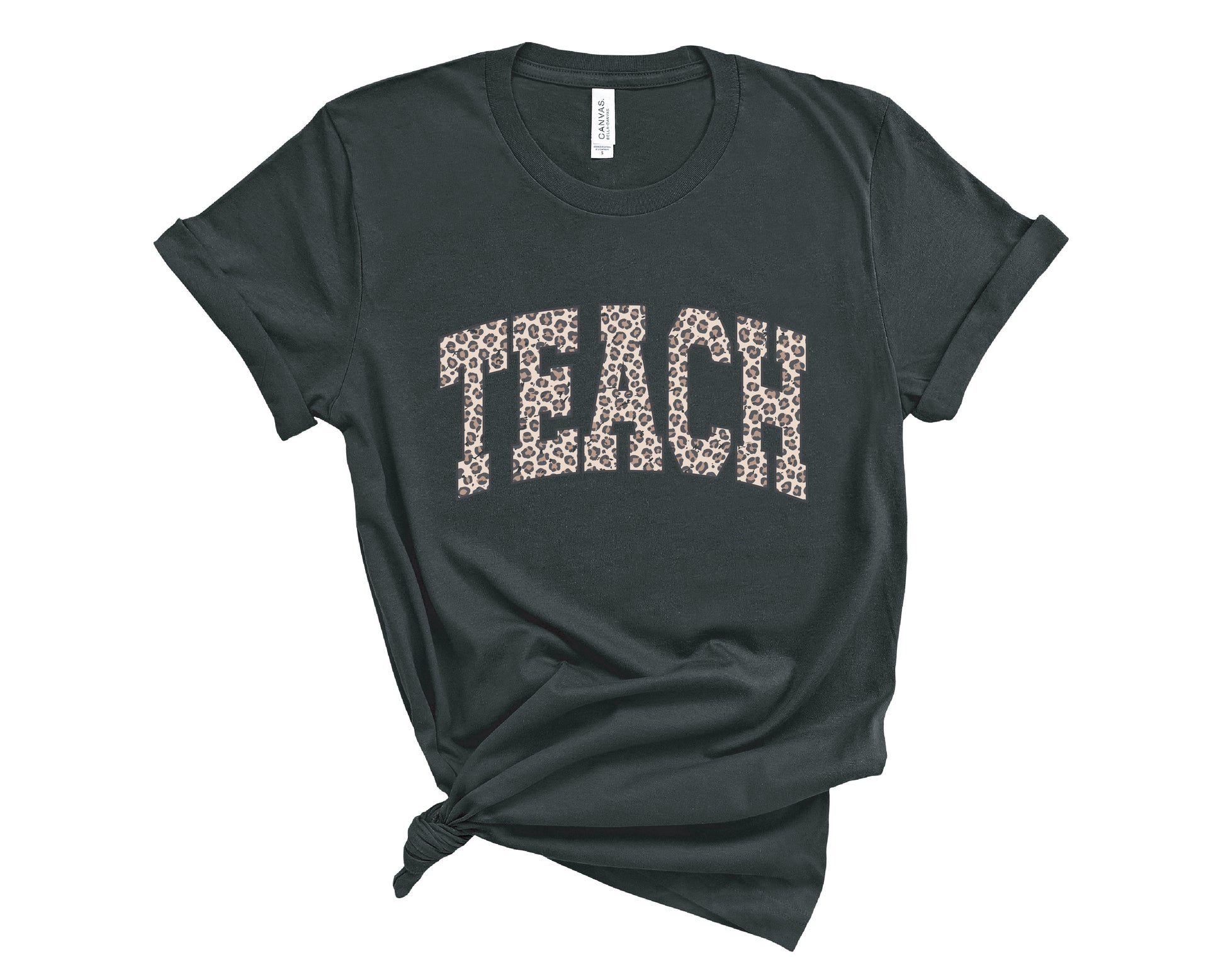 A black t-shirt with the word 'TEACH' printed across the chest in a leopard print pattern, styled with a knot at the bottom hem on a white background.