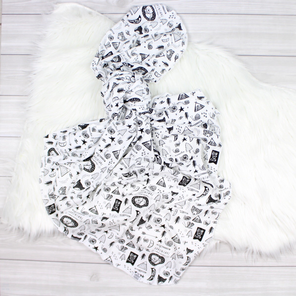 black and white woodland swaddle blanket